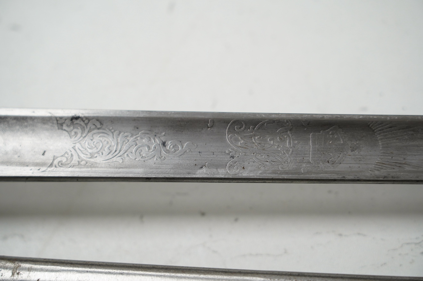 An 1895 pattern late Victorian infantry officer’s sword in its steel scabbard, made by E. Thurkle, 5 Denmark St. Soho, blade 83cm. Condition - good, however scabbard heavily cleaned